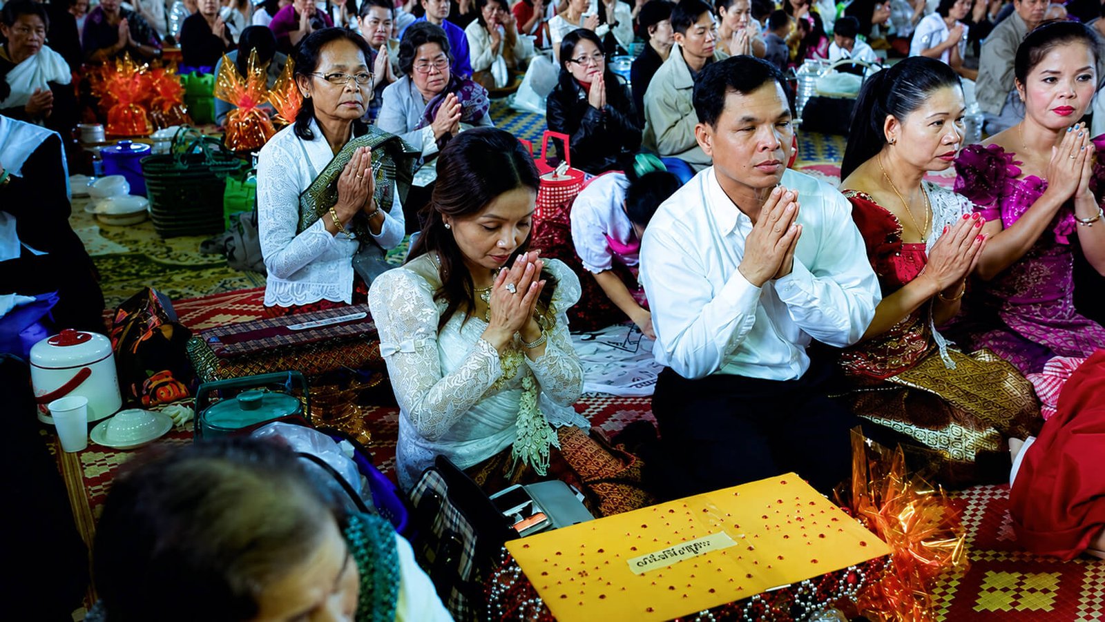 Khmer Buddhist community praying during the Kathina ceremony at Wat Buddharangsi Melbourne