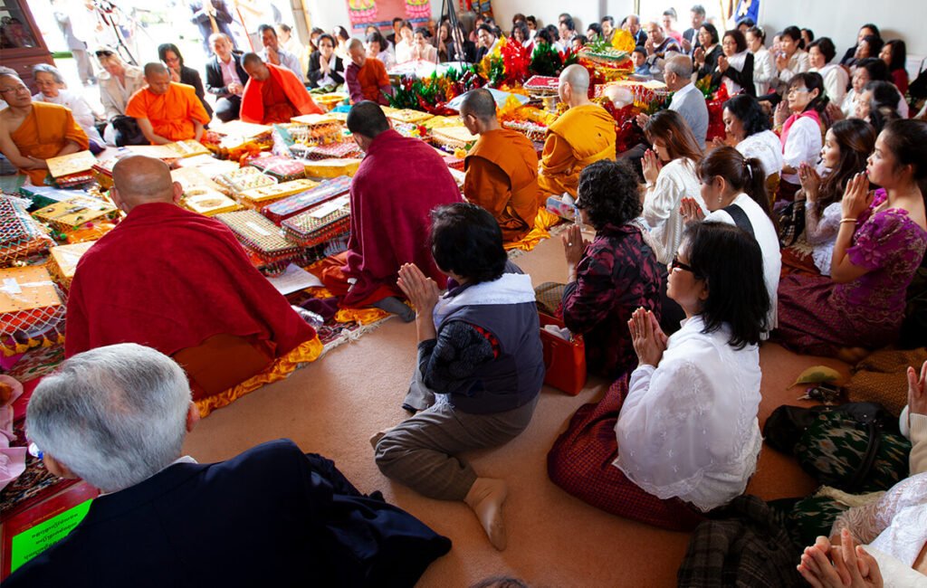 Community members presenting offerings during the Kathina ceremony at Wat Buddharangsi Melbourne