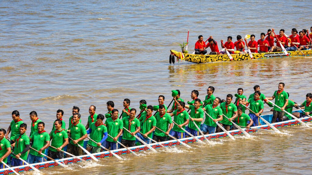 Cambodian boat racing team paddling during the Water Festival