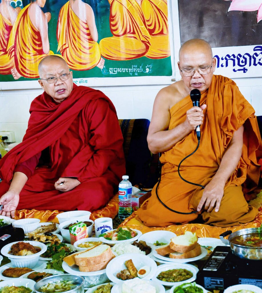 Buddhist monks giving blessings during a community meal at Wat Buddharangsi Melbourne
