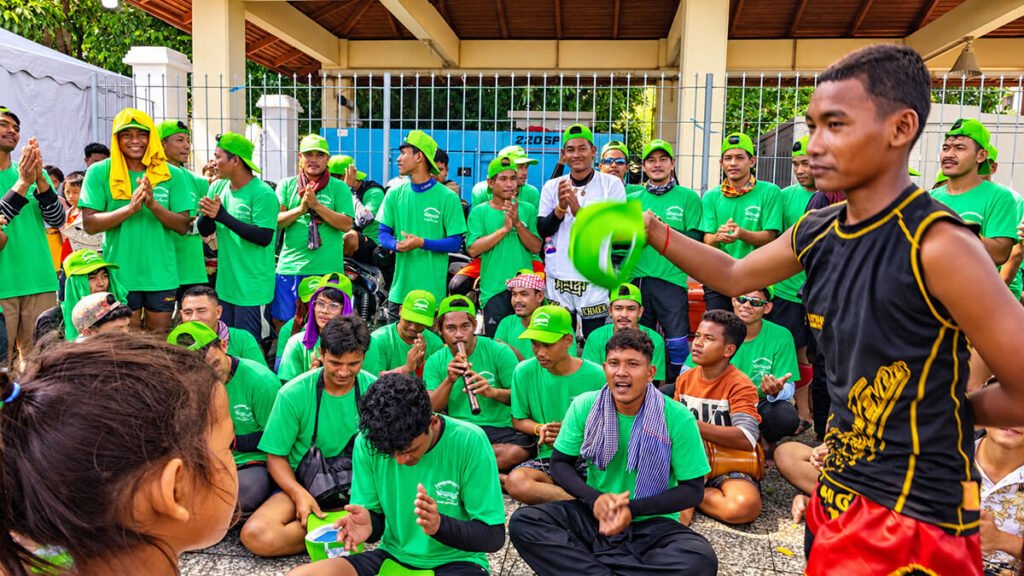 Cambodian boat racing team celebrating together during the Water Festival